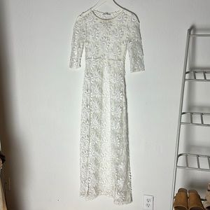 Coachella-ready see-through lace slip dress with a high leg slit